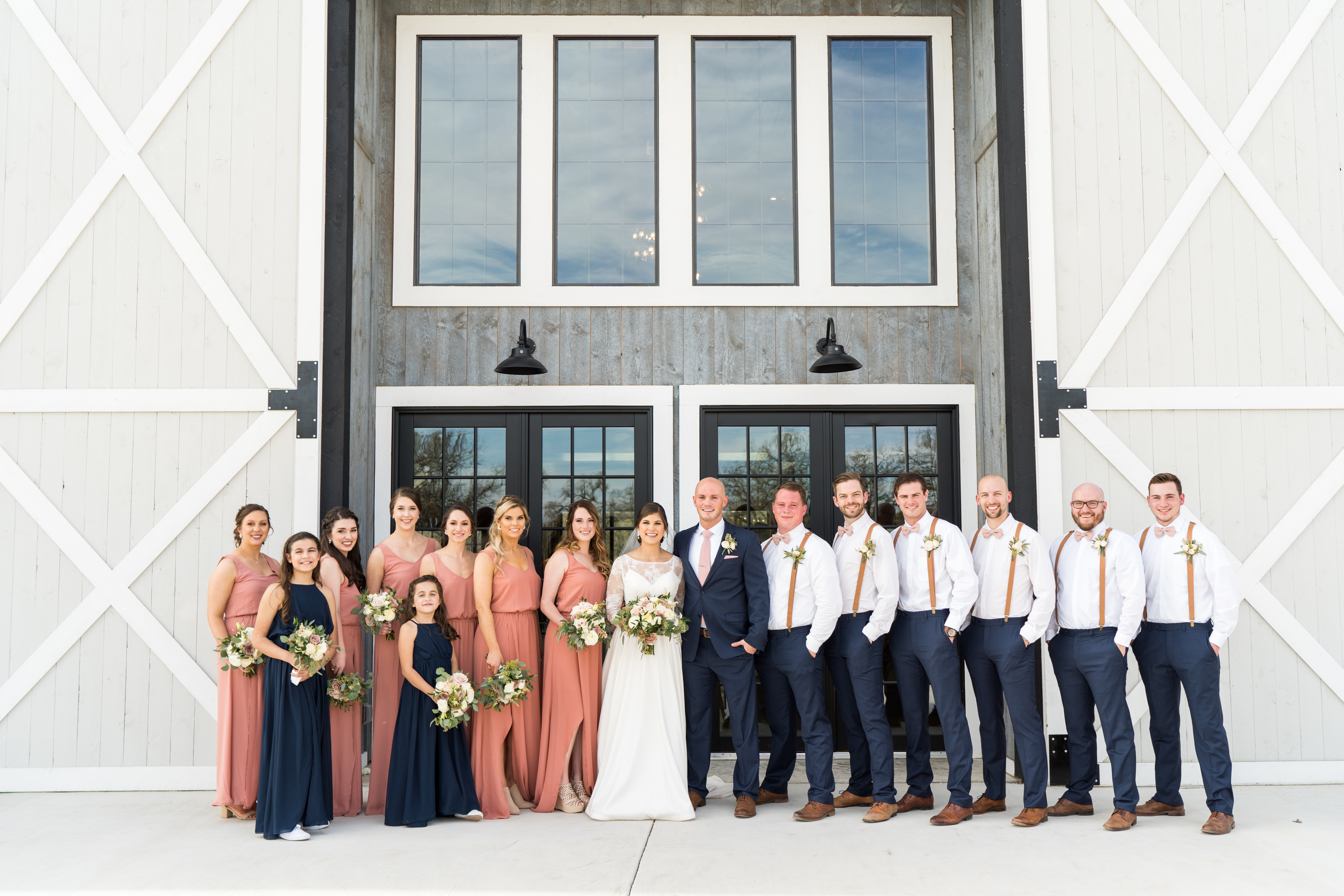 Large wedding party at a barn venue